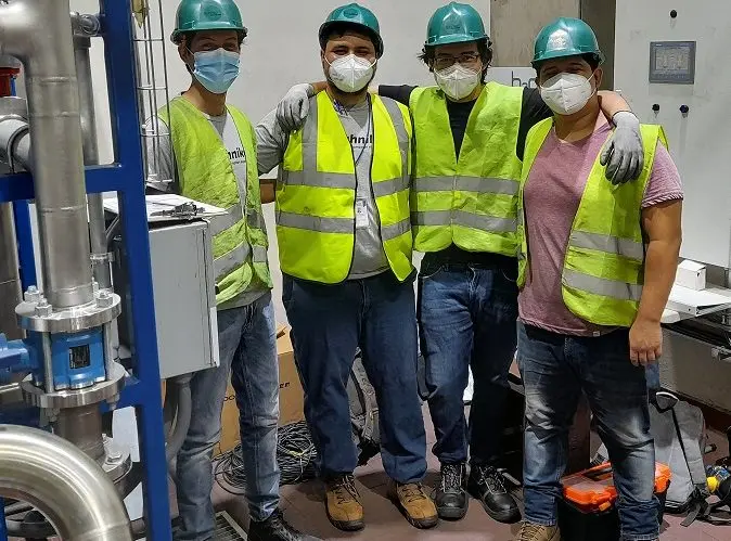 ERDE team in industrial setting with safety gear